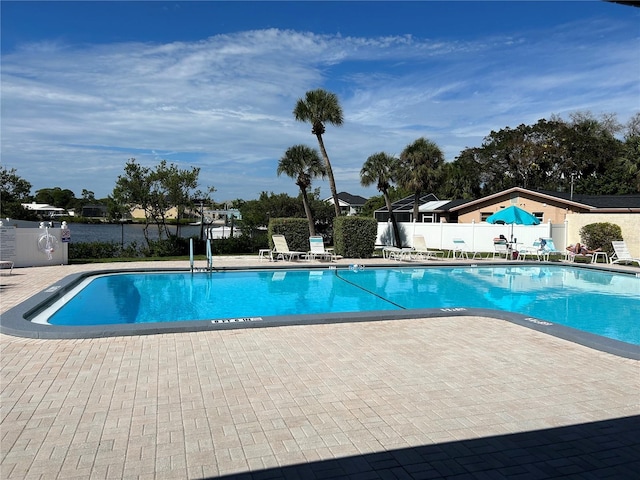 view of swimming pool with a patio area