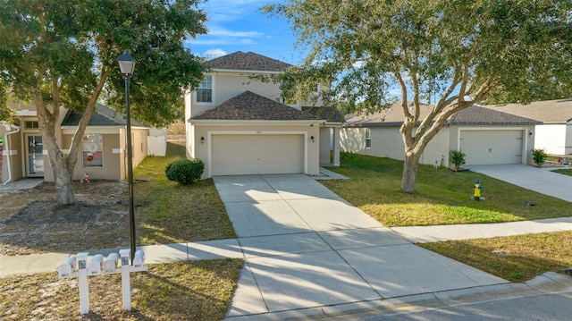 view of front of house featuring a garage and a front lawn