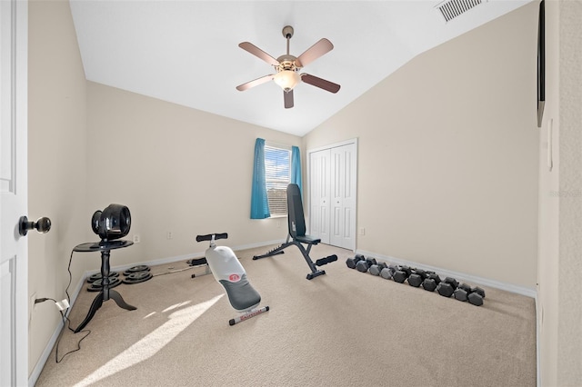 exercise area featuring carpet flooring, ceiling fan, and vaulted ceiling