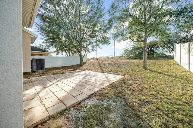 view of yard featuring a patio area and central AC unit