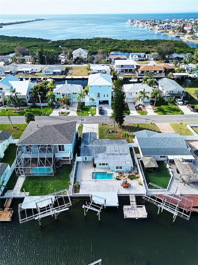 birds eye view of property with a water view