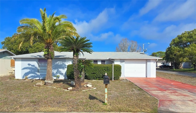 ranch-style house with a front lawn and a garage