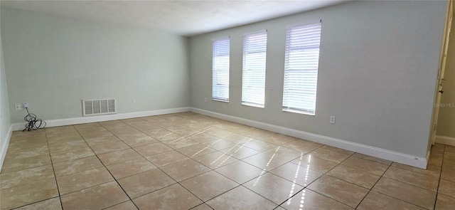 view of tiled spare room