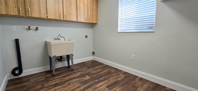 washroom featuring cabinets, dark hardwood / wood-style floors, and hookup for an electric dryer