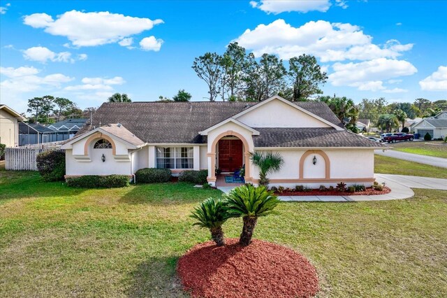 single story home with a front yard