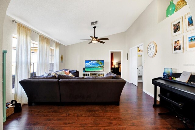 living room with vaulted ceiling, ceiling fan, and dark hardwood / wood-style floors