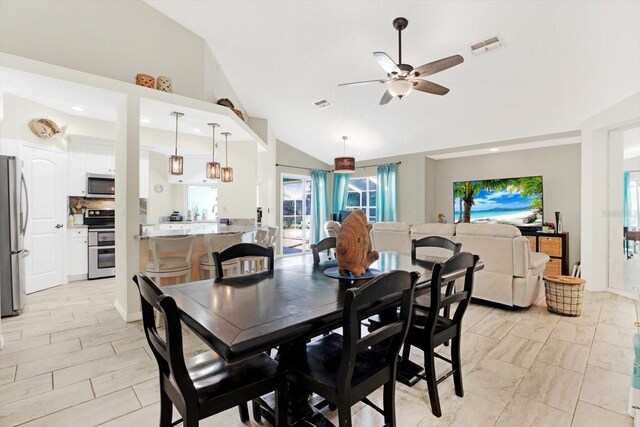 dining room featuring vaulted ceiling and ceiling fan