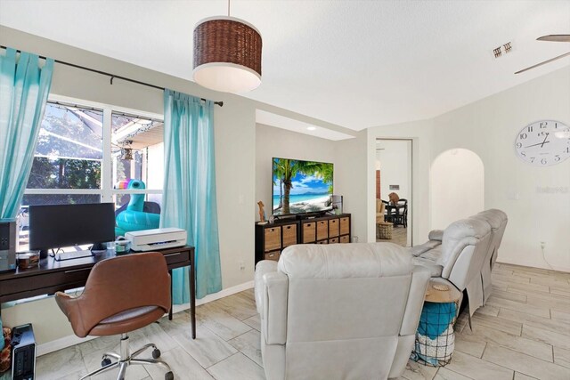 living room featuring ceiling fan