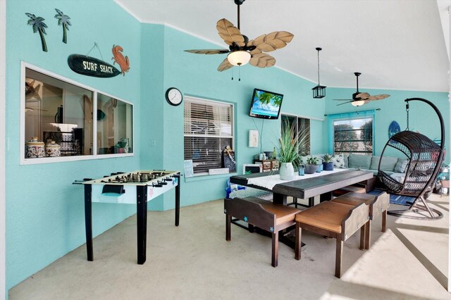 dining area with ceiling fan and lofted ceiling