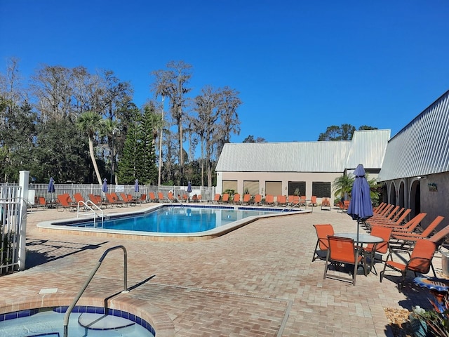 view of swimming pool with a patio