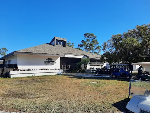 view of home's exterior with a yard