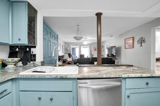 kitchen featuring ceiling fan, dishwasher, sink, blue cabinets, and a textured ceiling