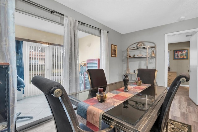 dining space with light wood-type flooring