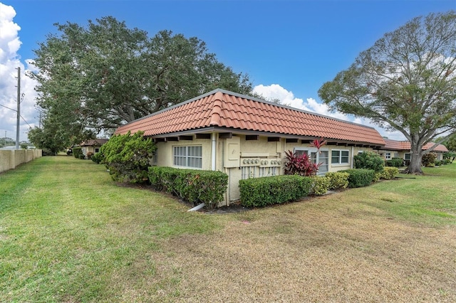 view of home's exterior featuring a lawn