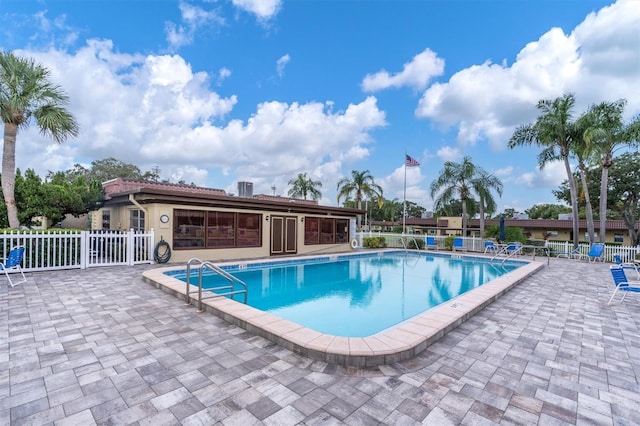 view of swimming pool with a patio