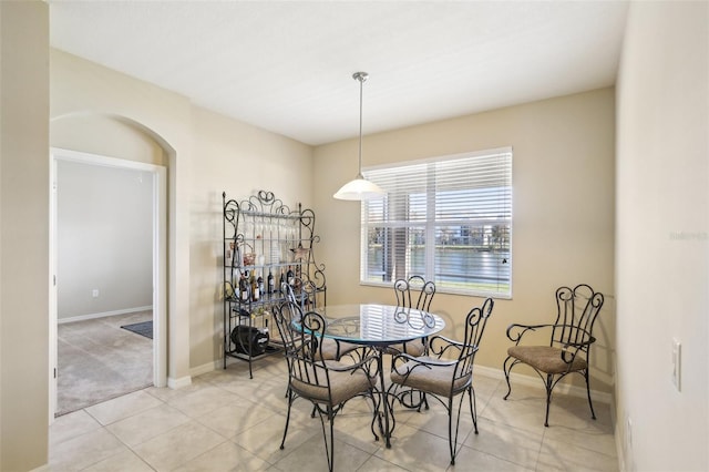 dining area featuring light tile patterned floors