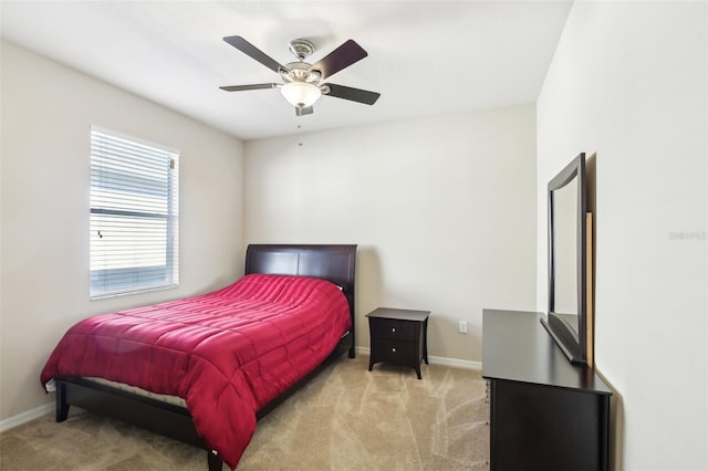 bedroom with light carpet and ceiling fan