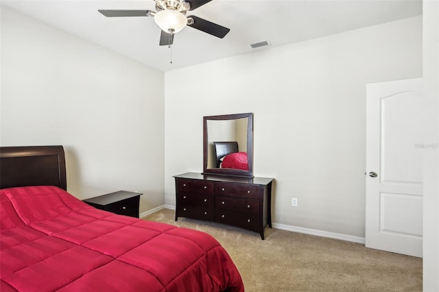 bedroom featuring ceiling fan and light carpet