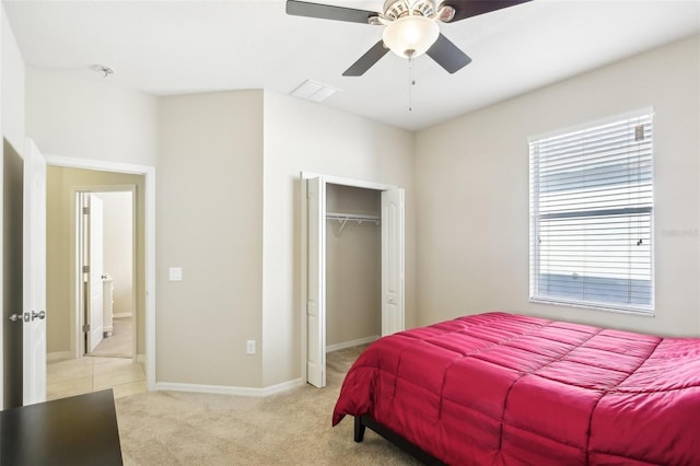 carpeted bedroom featuring a closet and ceiling fan