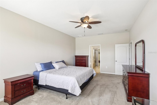 carpeted bedroom featuring ensuite bathroom and ceiling fan