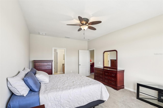 bedroom with ceiling fan and light colored carpet