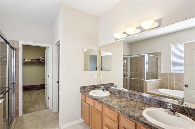 bathroom featuring tile patterned floors, vanity, and independent shower and bath