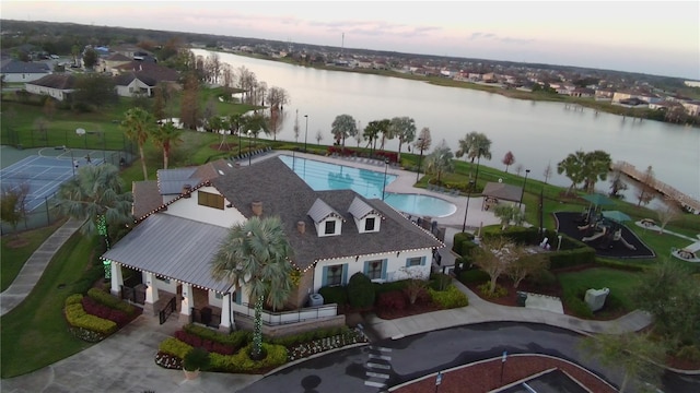 aerial view at dusk with a water view