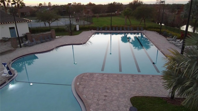 pool at dusk with a bar