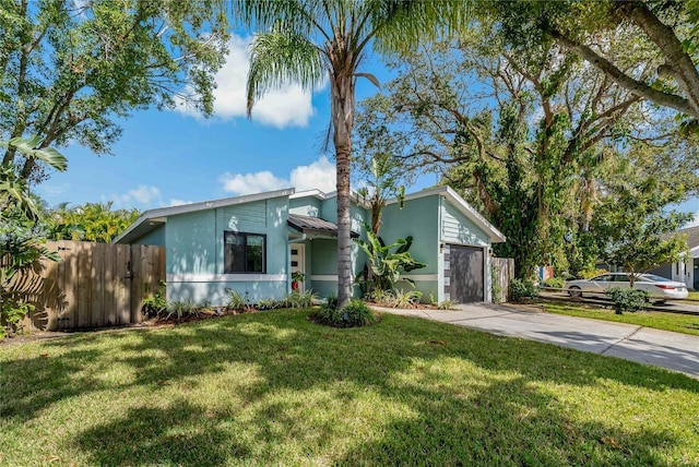 view of front facade featuring a front lawn and a garage