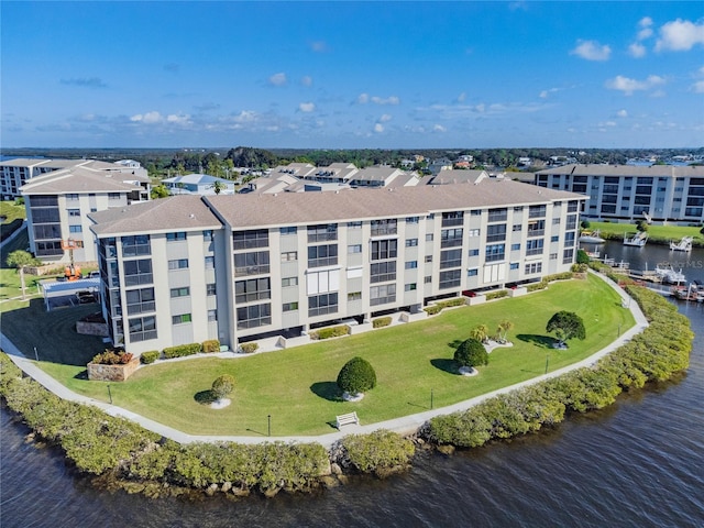 birds eye view of property featuring a water view