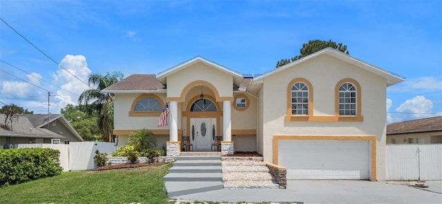 view of front facade featuring a garage and a front yard