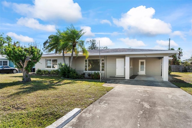 ranch-style home with a carport, covered porch, and a front lawn