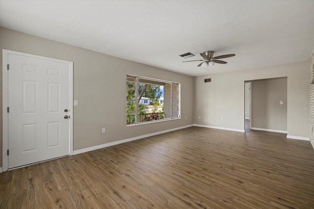 106 Aurora St E, Venice, FL 34285 - unfurnished living room with baseboards, ceiling fan, wood finished floors, and visible vents