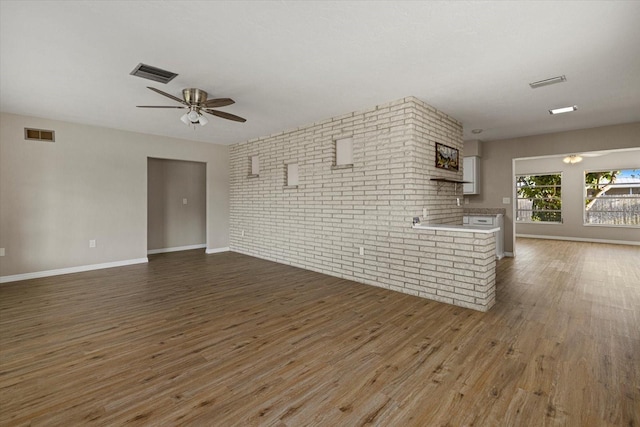 106 Aurora St E, Venice, FL 34285 - unfurnished living room with a ceiling fan, wood finished floors, and visible vents
