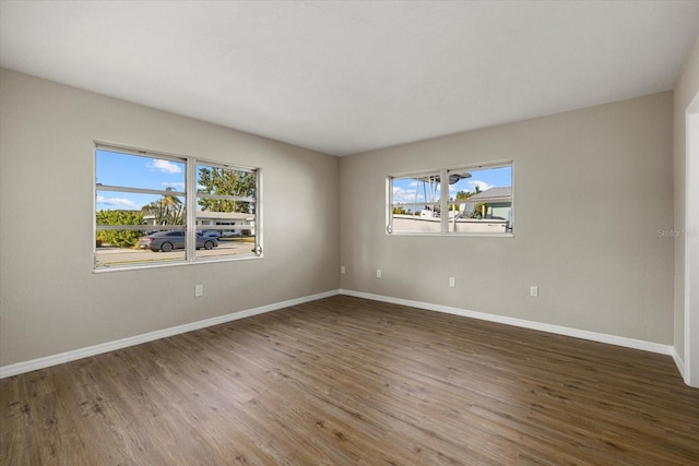 106 Aurora St E, Venice, FL 34285 - spare room featuring baseboards and wood finished floors
