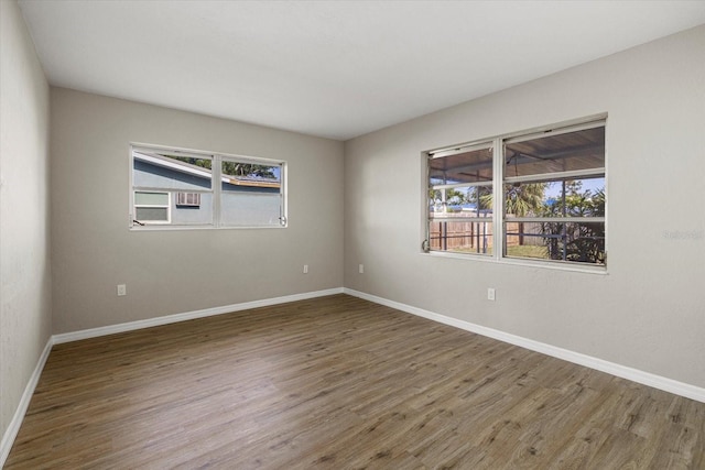 106 Aurora St E, Venice, FL 34285 - unfurnished room featuring baseboards and wood finished floors