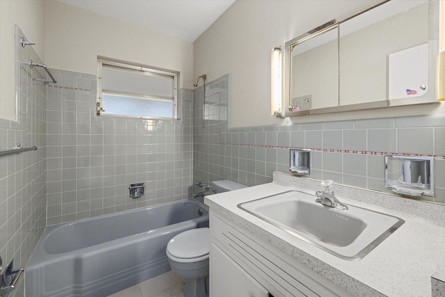 106 Aurora St E, Venice, FL 34285 - full bath with shower / bathtub combination, toilet, tile walls, and vanity