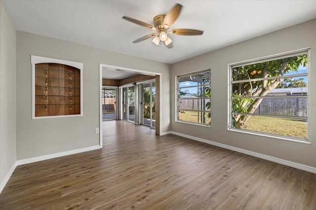 106 Aurora St E, Venice, FL 34285 - empty room with baseboards, a ceiling fan, and wood finished floors