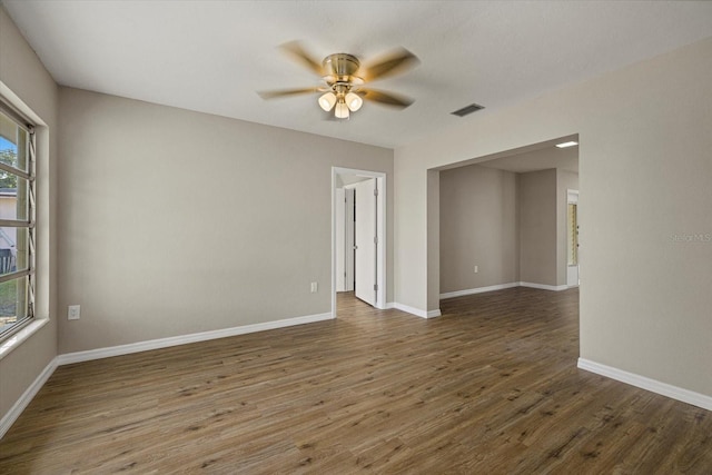 106 Aurora St E, Venice, FL 34285 - spare room featuring visible vents, baseboards, ceiling fan, and wood finished floors