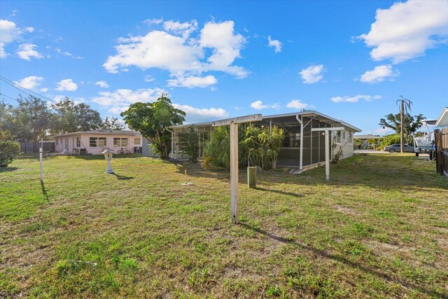 106 Aurora St E, Venice, FL 34285 - view of yard featuring fence and a sunroom