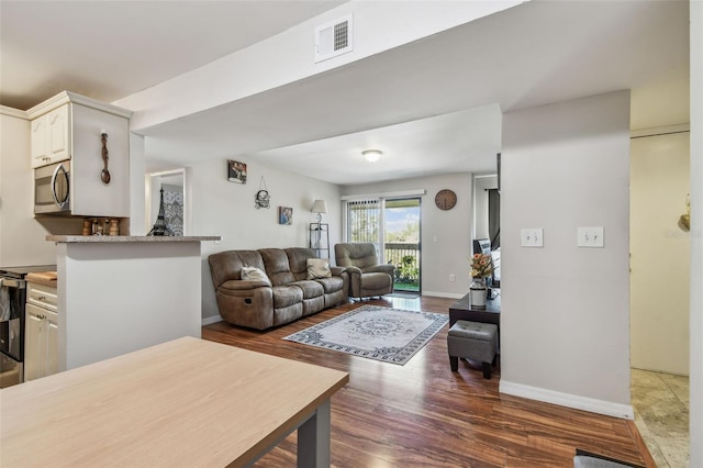 living room featuring dark hardwood / wood-style floors