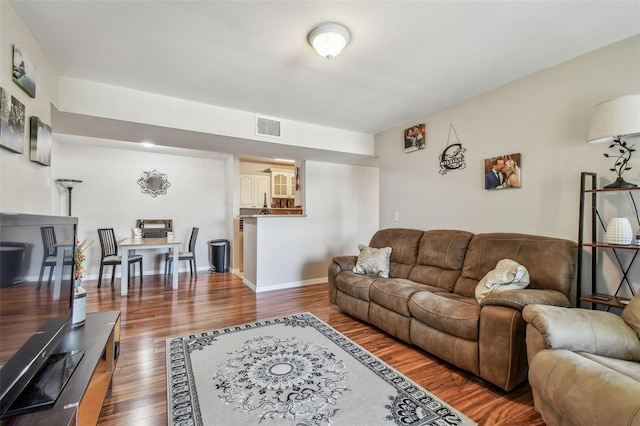 living room with dark wood-type flooring