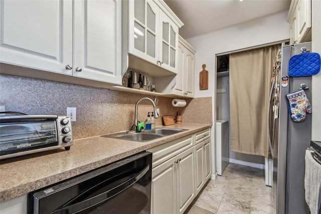 kitchen with dishwasher, white cabinetry, sink, and tasteful backsplash