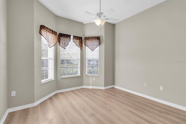 unfurnished room with ceiling fan and light hardwood / wood-style flooring