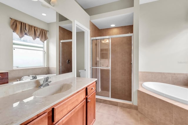 full bathroom featuring tile patterned flooring, vanity, toilet, and separate shower and tub