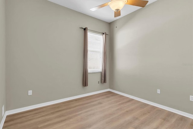 spare room with light hardwood / wood-style flooring and ceiling fan