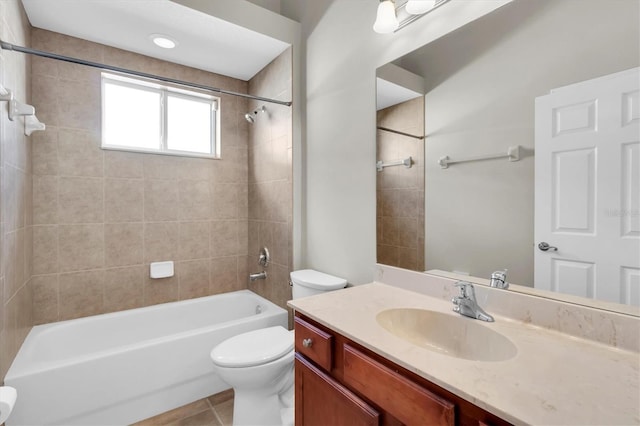 full bathroom with tile patterned floors, vanity, toilet, and tiled shower / bath