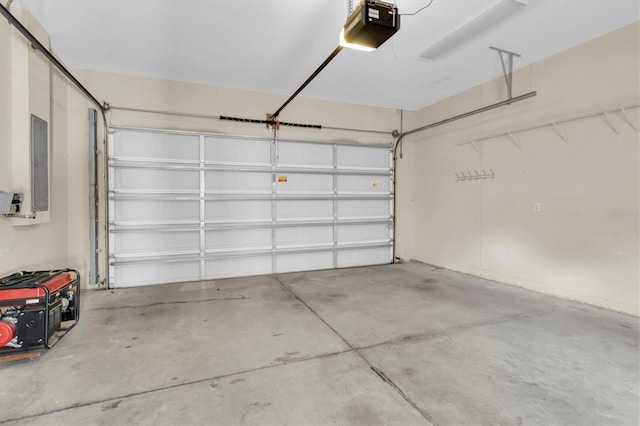 garage featuring electric panel and a garage door opener