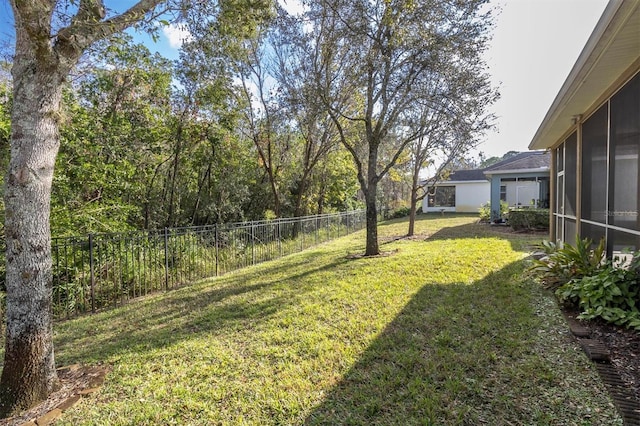 view of yard featuring a sunroom