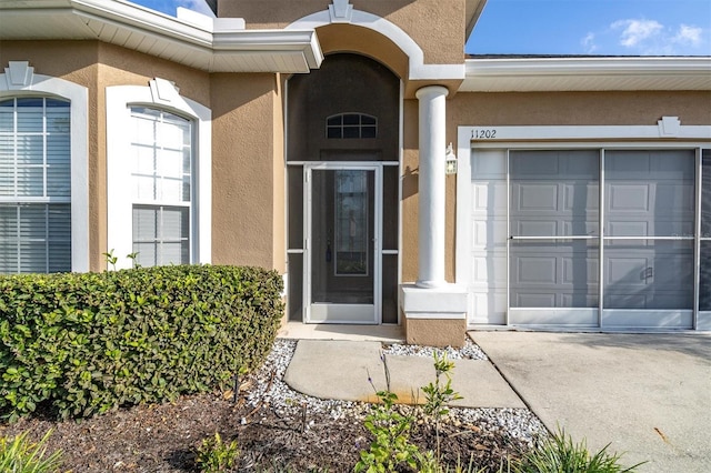 property entrance with a garage